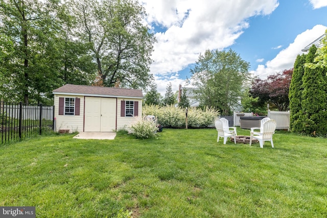 2921 Toll Gate Dr, East Norriton, PA 19403 - view of yard with an outdoor structure, a hot tub, and a fire pit