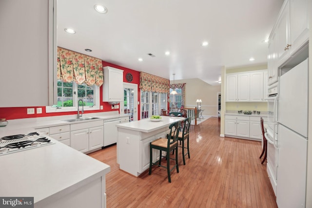 10017 Prestwich Ter, Ijamsville, MD 21754 - kitchen with a kitchen island, white appliances, a sink, white cabinets, and recessed lighting