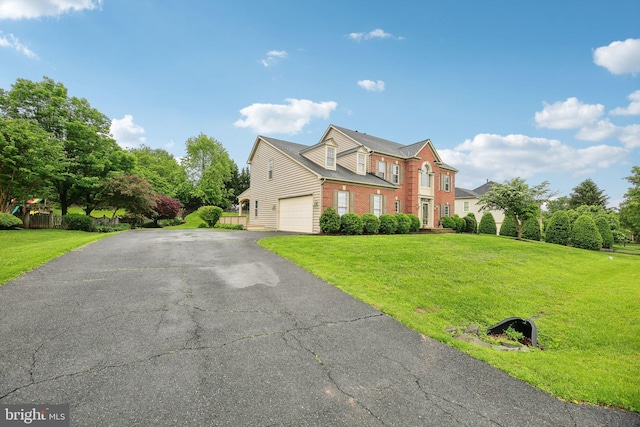 10017 Prestwich Ter, Ijamsville, MD 21754 - view of front of house featuring driveway, a front lawn, and brick siding