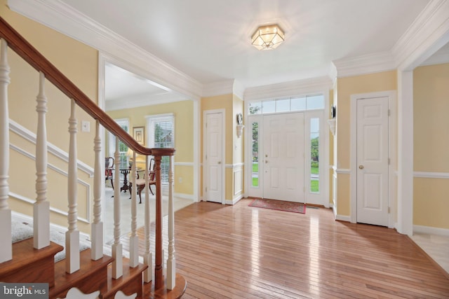 10017 Prestwich Ter, Ijamsville, MD 21754 - foyer with light wood-style floors, stairs, ornamental molding, and baseboards