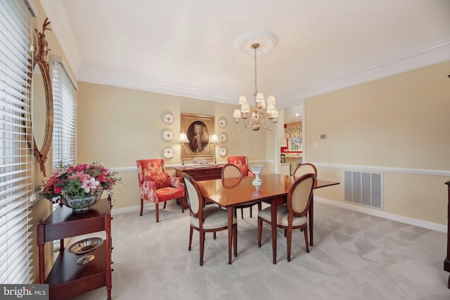 10017 Prestwich Ter, Ijamsville, MD 21754 - dining area with crown molding, carpet flooring, a chandelier, and baseboards
