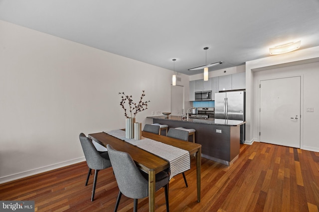 2101 Market St Unit 705, Philadelphia, PA 19103 - dining area with dark wood finished floors and baseboards