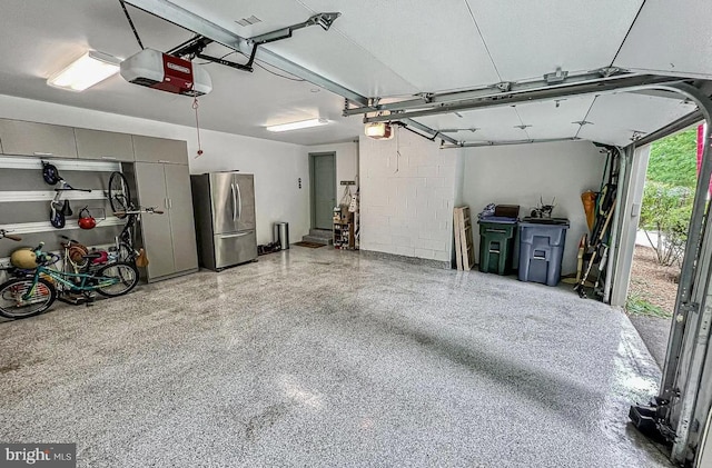 1448 Laurel Hill Rd, Vienna, VA 22182 - garage featuring freestanding refrigerator and a garage door opener