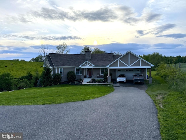 6628 New London Rd, New Market, MD 21774 - view of front of house with asphalt driveway, a front lawn, a garage, covered porch, and a chimney