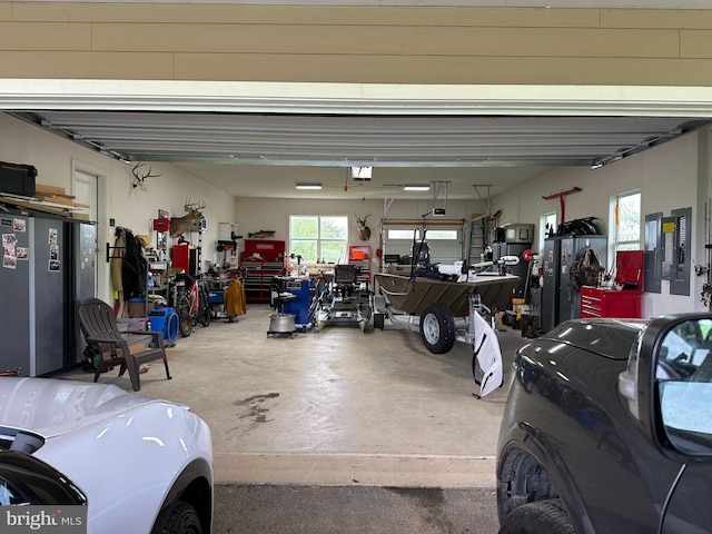 6628 New London Rd, New Market, MD 21774 - garage with a workshop area, a garage door opener, and electric panel