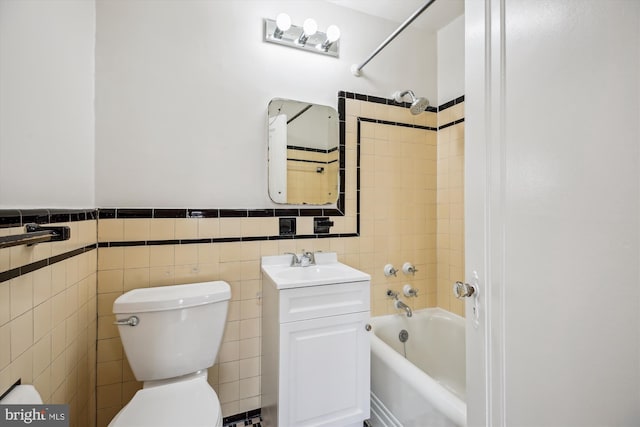 1362 Sheridan St NW, Washington, DC 20011 - full bath featuring shower / bathtub combination, tile walls, vanity, and wainscoting