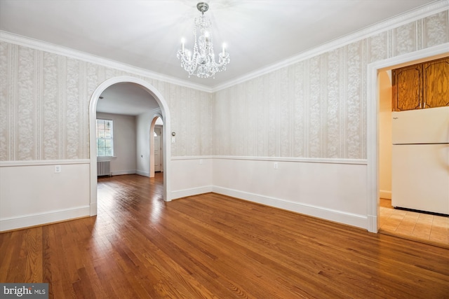 1362 Sheridan St NW, Washington, DC 20011 - unfurnished dining area featuring wallpapered walls, arched walkways, radiator heating unit, a chandelier, and wood finished floors