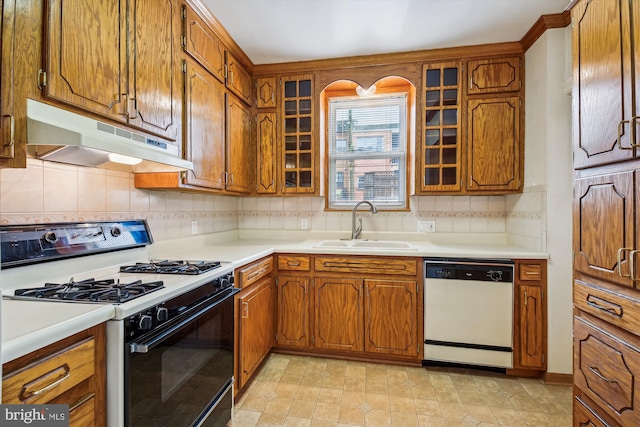 1362 Sheridan St NW, Washington, DC 20011 - kitchen featuring gas range oven, dishwasher, under cabinet range hood, and brown cabinetry