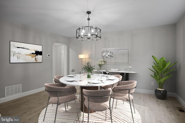 918 Andorra Rd, Lafayette Hill, PA 19444 - dining space featuring baseboards, a notable chandelier, light wood finished floors, and visible vents