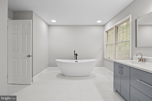 918 Andorra Rd, Lafayette Hill, PA 19444 - bathroom featuring vanity, baseboards, a freestanding tub, and recessed lighting