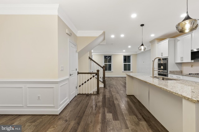 3745 Signal Knob Ct, Falls Church, VA 22041 - kitchen with ornamental molding, stainless steel appliances, white cabinets, light stone counters, and dark wood-style floors