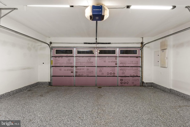 3745 Signal Knob Ct, Falls Church, VA 22041 - garage featuring baseboards, a garage door opener, and electric panel