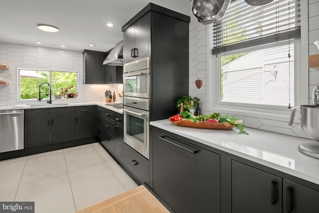 3175 21st St N, Arlington, VA 22201 - kitchen featuring a sink, tasteful backsplash, light countertops, and appliances with stainless steel finishes