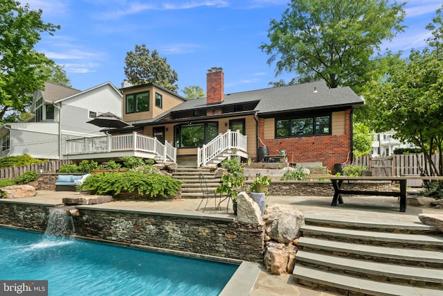3175 21st St N, Arlington, VA 22201 - back of property with fence, a chimney, brick siding, and a fenced in pool
