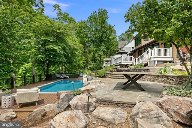 3175 21st St N, Arlington, VA 22201 - view of swimming pool featuring a wooden deck, a fenced in pool, fence, and a patio
