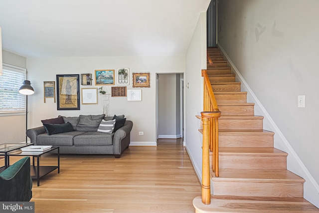 6226 Long Meadow Dr, Sykesville, MD 21784 - living room with stairs, light wood-type flooring, and baseboards