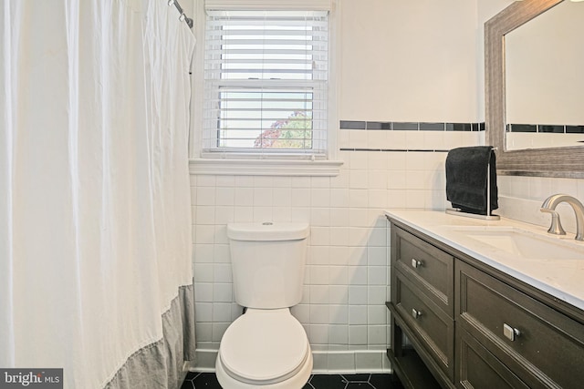 6226 Long Meadow Dr, Sykesville, MD 21784 - full bath featuring toilet, tile walls, vanity, tile patterned flooring, and a shower with shower curtain