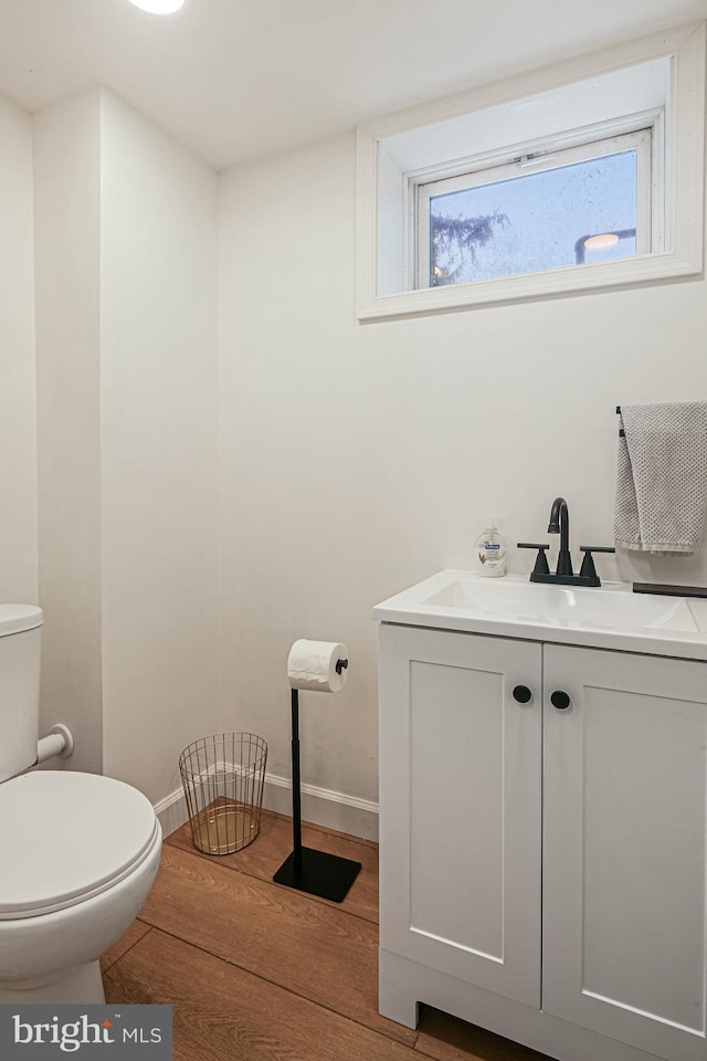 6226 Long Meadow Dr, Sykesville, MD 21784 - half bath featuring toilet, wood finished floors, vanity, and baseboards