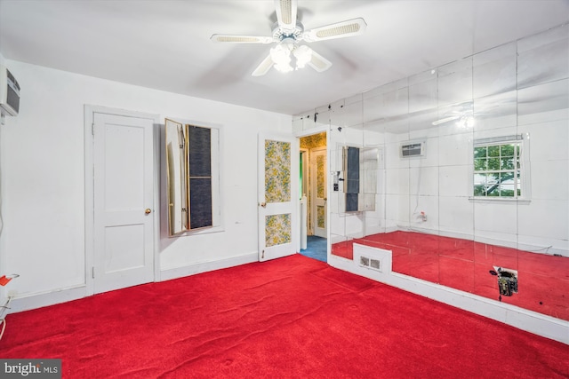 4307 39th Pl, Brentwood, MD 20722 - interior space featuring a wall mounted AC, dark colored carpet, baseboards, and ceiling fan