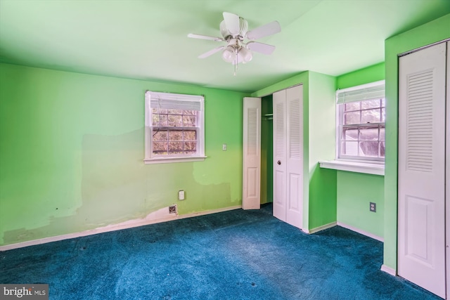 4307 39th Pl, Brentwood, MD 20722 - unfurnished bedroom with baseboards, multiple windows, multiple closets, and carpet floors