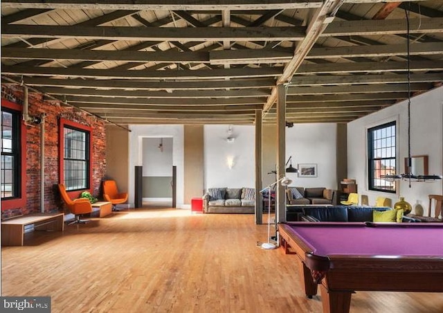 rec room featuring billiards, beamed ceiling, and wood finished floors
