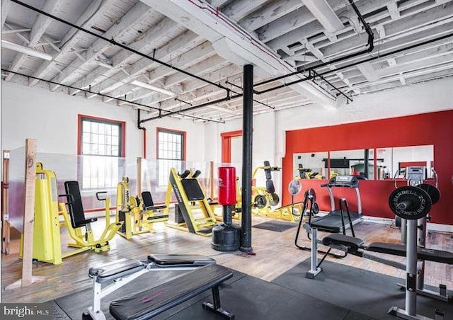 exercise room with wood finished floors