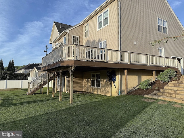 back of house with a yard, stairway, and a wooden deck