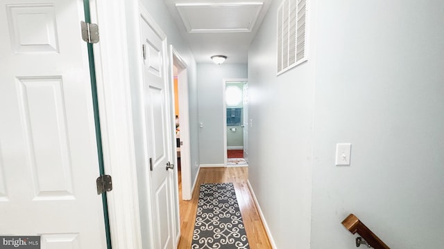 246 Choptank Rd, Stafford, VA 22556 - hallway with light wood-style flooring, baseboards, and attic access