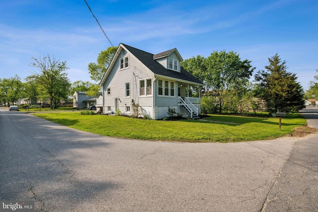 view of side of property with a yard