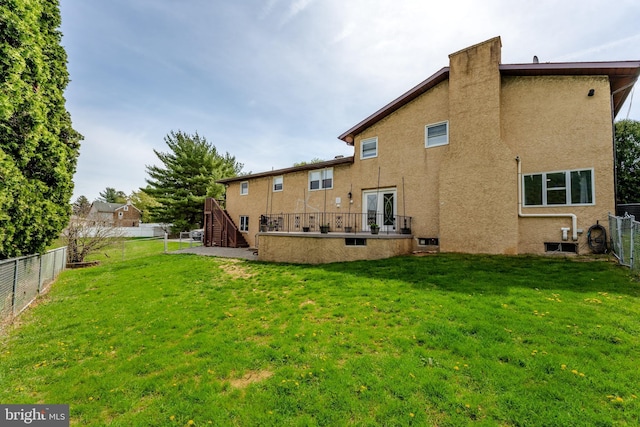 1650 Easton Rd, Hellertown, PA 18055 - back of house with a yard, stucco siding, a fenced backyard, and stairs