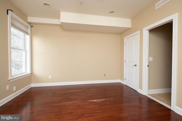 unfurnished room featuring baseboards, recessed lighting, visible vents, and wood finished floors