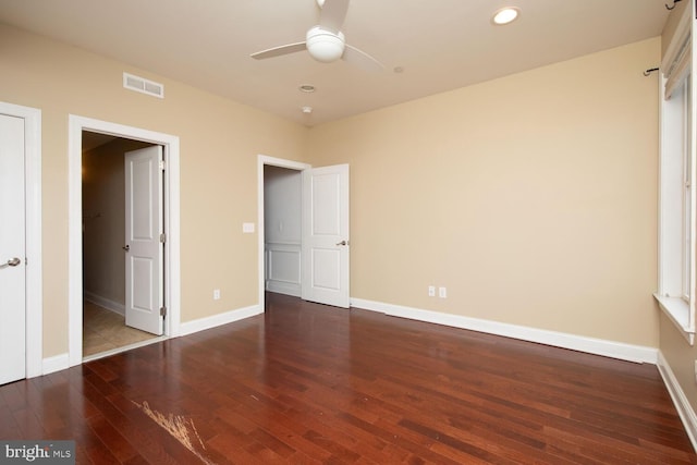 unfurnished bedroom with a ceiling fan, recessed lighting, baseboards, visible vents, and hardwood / wood-style flooring