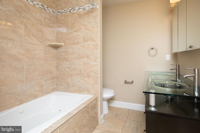 bathroom with a sink, toilet, baseboards, and tile patterned floors