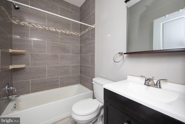 bathroom featuring vanity, toilet, and shower / bathing tub combination
