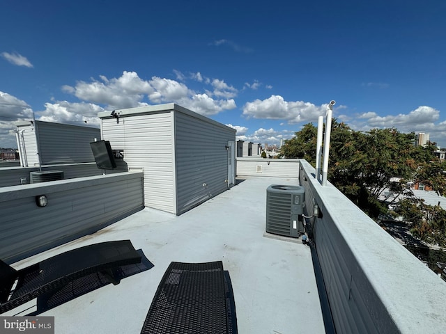 view of patio / terrace featuring cooling unit and a balcony