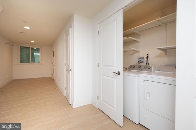 laundry room featuring separate washer and dryer, laundry area, visible vents, baseboards, and recessed lighting