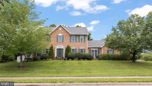 100 Lucy Long Ct, Stephens City, VA 22655 - colonial-style house featuring brick siding, a front lawn, and a shingled roof