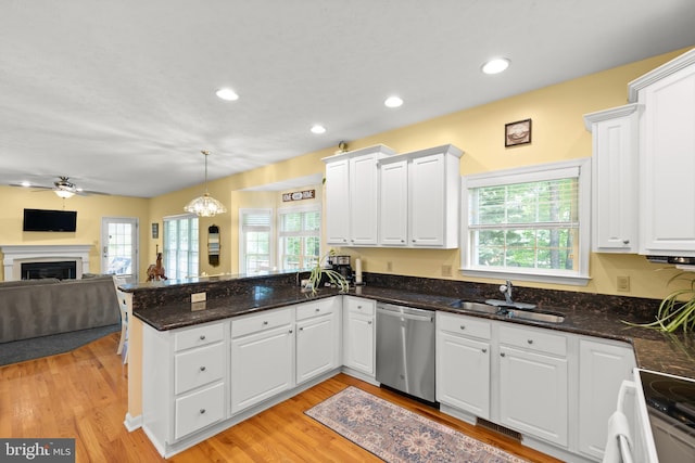 100 Lucy Long Ct, Stephens City, VA 22655 - kitchen with dishwasher, a sink, a peninsula, open floor plan, and white cabinetry
