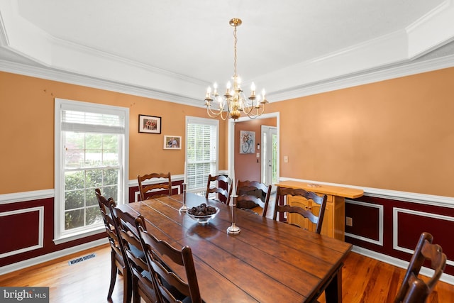 100 Lucy Long Ct, Stephens City, VA 22655 - dining area featuring a tray ceiling, a chandelier, wood finished floors, ornamental molding, and wainscoting