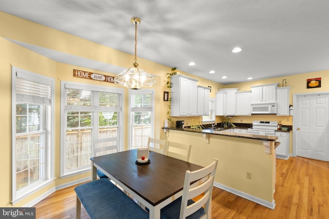 100 Lucy Long Ct, Stephens City, VA 22655 - dining space with a chandelier, light wood-type flooring, recessed lighting, and baseboards