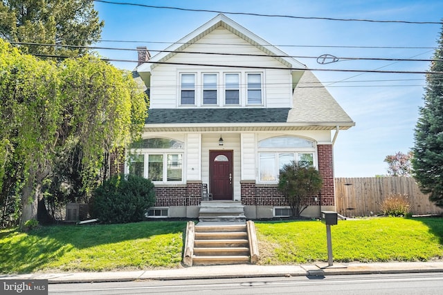 935 N Brookside Rd, Allentown, PA 18106 - view of front of home with a front yard, roof with shingles, brick siding, and fence
