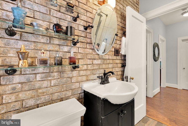 1613 Harvard St NW Unit 105, Washington, DC 20009 - bathroom featuring wood finished floors, baseboards, and vanity