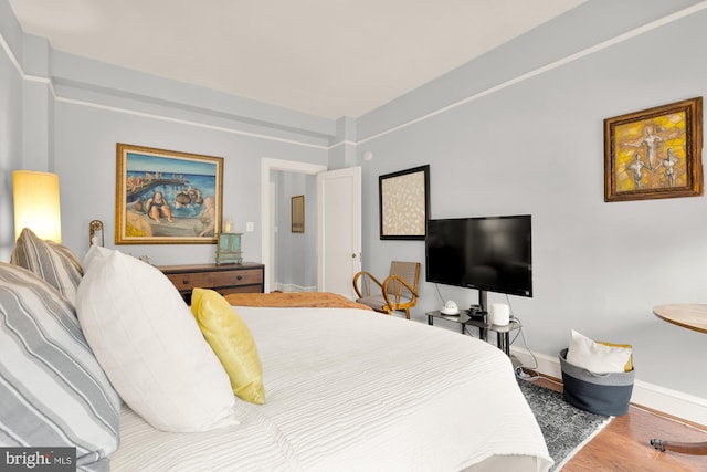 1613 Harvard St NW Unit 105, Washington, DC 20009 - bedroom with wood finished floors and baseboards