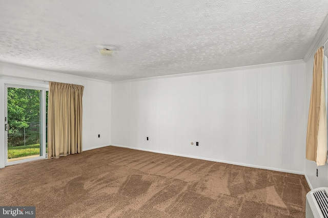 carpeted spare room featuring a textured ceiling and ornamental molding