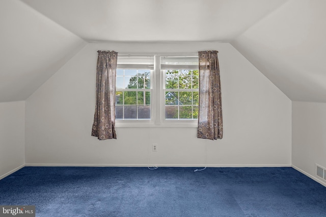 bonus room with vaulted ceiling, carpet flooring, and baseboards