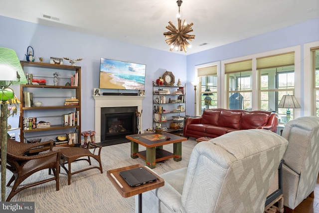 23593 Robalo Rd, Frankford, DE 19945 - living room with wood finished floors, a glass covered fireplace, and a chandelier