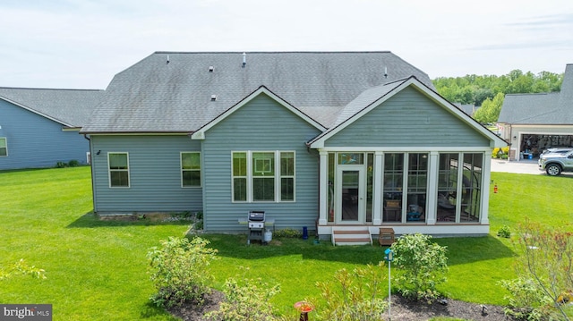 23593 Robalo Rd, Frankford, DE 19945 - back of house with a sunroom, a yard, and a shingled roof