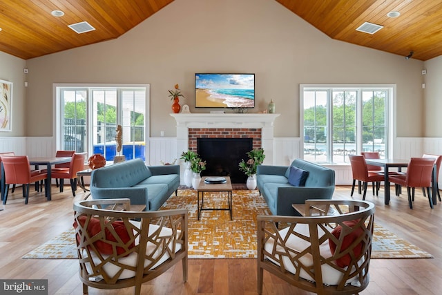 23593 Robalo Rd, Frankford, DE 19945 - living area featuring wooden ceiling, a wainscoted wall, light wood-type flooring, recessed lighting, and a fireplace