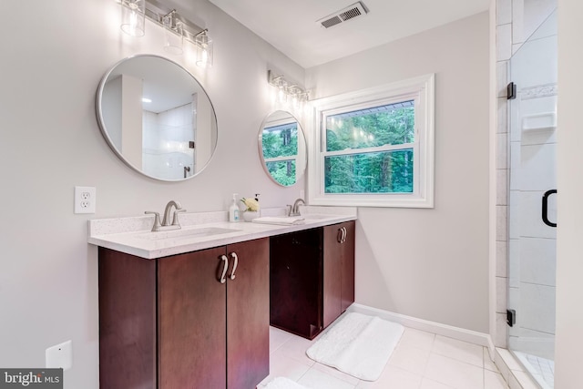 6488 Davis Ford Rd, Manassas, VA 20111 - bathroom featuring double vanity, baseboards, a stall shower, and tile patterned flooring
