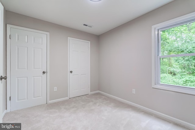 6488 Davis Ford Rd, Manassas, VA 20111 - unfurnished bedroom featuring light carpet and baseboards